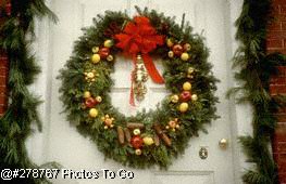 Christmas wreath and decorations on door